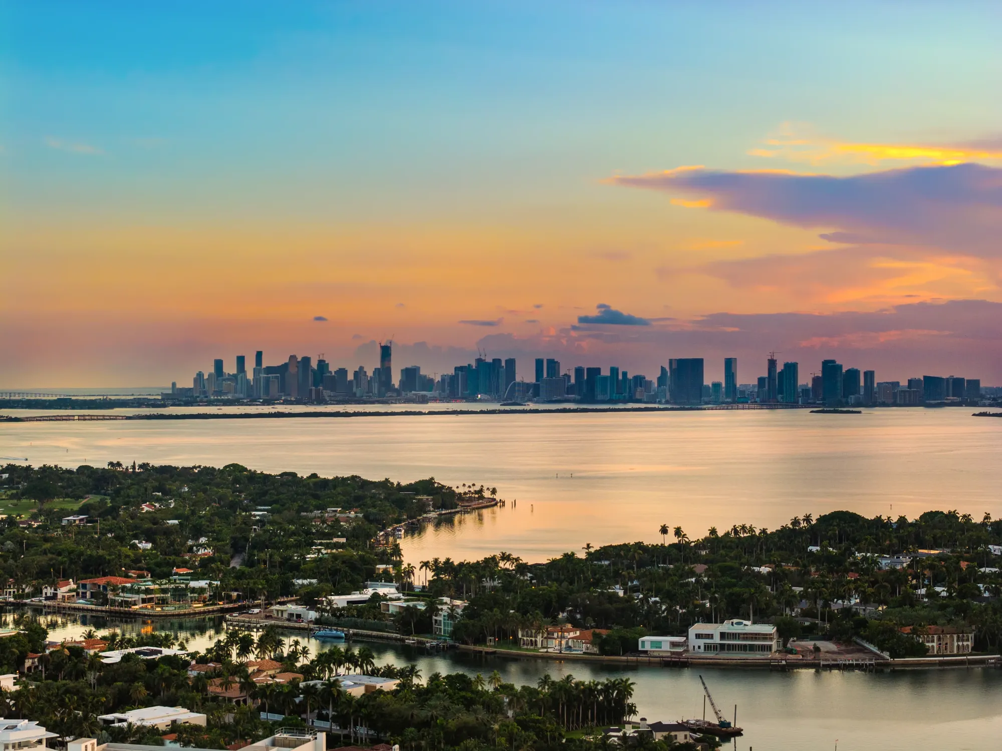 Aerial twilight view across Biscayne Bay to downtown Miami